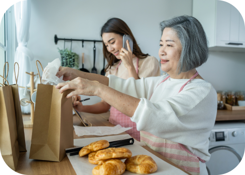 asian-happy-family-senior-mom-and-daughter-cook-f-2021-12-09-20-22-59-utc 1